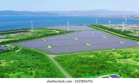 Solar Power Plant And Windmills Aerial View. Renewable Energy. Green Tech.