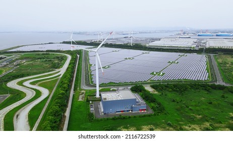 Solar Power Plant And Windmills Aerial View. Renewable Energy. Green Tech.