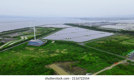 Solar Power Plant And Windmills Aerial View. Renewable Energy. Green Tech.