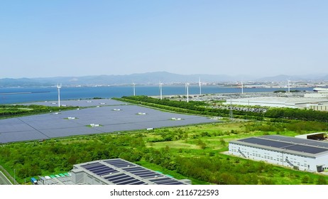 Solar Power Plant And Windmills Aerial View. Renewable Energy. Green Tech.