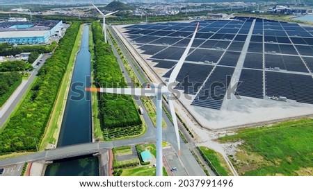 Solar power plant and Windmills aerial view. Renewable energy. Green tech.