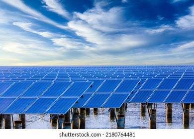 Solar Power Station At Beautiful Sunset. Solar Photovoltaic Power Station On Water. 