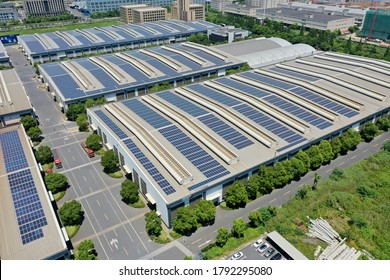 solar power station with factory - Shutterstock ID 1792295080