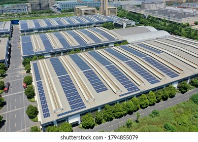 solar power station with factory - Shutterstock ID 1794855079