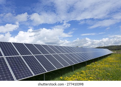 Solar Power Station on the spring flowering Meadow  - Shutterstock ID 277410398