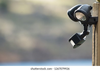 Solar powered sensor lights mounted to a pole