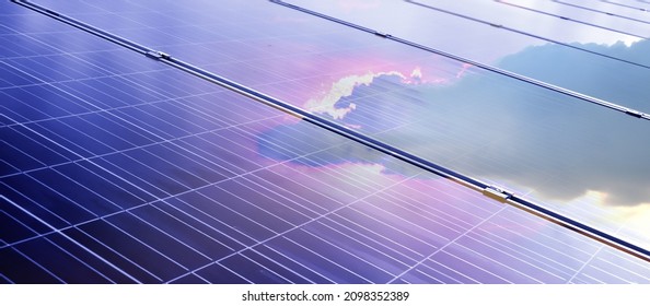 Solar rooftop with reflection of the sun and cloud, soft and selective focus.