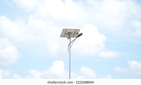 Solar Street Light Lamp Post Led With Panel System On The Road With Blue Sky And Tree For Background Energy Saving Concept.