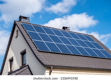 Solar system on a roof Own home - Shutterstock ID 1336991930