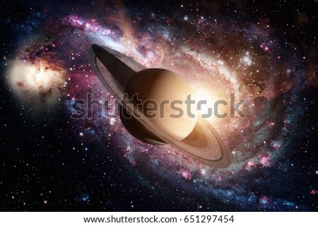 Solar System - Saturn. It is the sixth planet from the Sun and the second-largest in the Solar System. It is a gas giant planet and has a ring system. Elements of this image furnished by NASA.