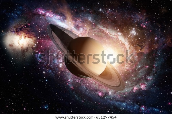 Solar System - Saturn. It is the sixth planet from\
the Sun and the second-largest in the Solar System. It is a gas\
giant planet and has a ring system. Elements of this image\
furnished by NASA.