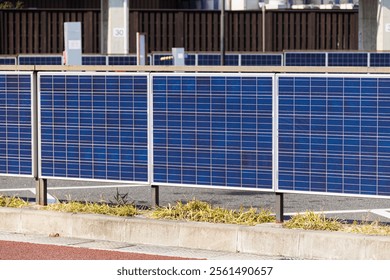 Solar wall, Solar fence using Solar panel power system for saving energy in modern green eco city smart technology innovation for sustainability