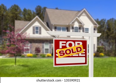 Sold Home For Sale Real Estate Sign and Beautiful New House.
