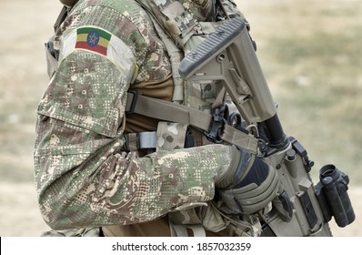 Soldier with assault rifle and flag of Ethiopia on military uniform. Collage. 