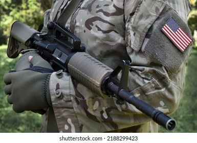 Soldier With Assault Rifle And US Flag