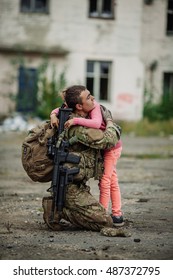 Soldier And Children On Battlefield Background. Military And Rescue Operation Concept.