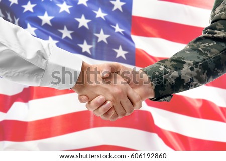 Soldier and civilian shaking hands on USA flag background