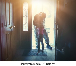 A Soldier Dad Is Coming Home In The Door And Hugging His Child For A Love, Family Or Reunited Concept.