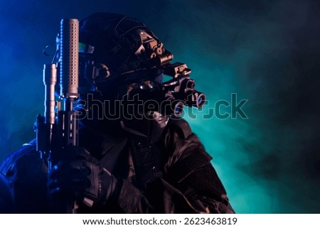 A soldier equipped with tactical gear, night vision goggles, and a firearm positioned under fog-lit conditions, conveying stealth, readiness, and modern military equipment during a covert operation.