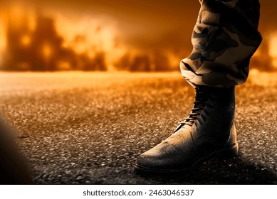 Soldier feet with military boots standing with fire and explosion on war scene background - Powered by Shutterstock