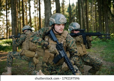 Soldier Fighters Standing Together With Guns. Group Portrait Of US Army Elite Members, Private Military Company Servicemen, Anti Terrorist Squad