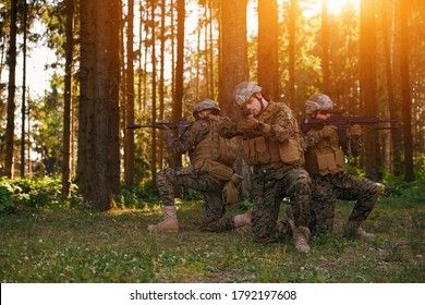 Soldier Fighters Standing Together With Guns. Group Portrait Of US Army Elite Members, Private Military Company Servicemen, Anti Terrorist Squad