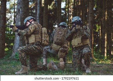 Soldier Fighters Standing Together With Guns. Group Portrait Of US Army Elite Members, Private Military Company Servicemen, Anti Terrorist Squad