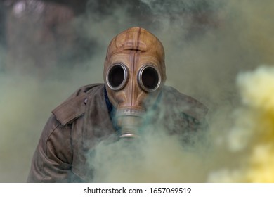 Soldier In Gas Mask Looking Trough Poisonous Fog