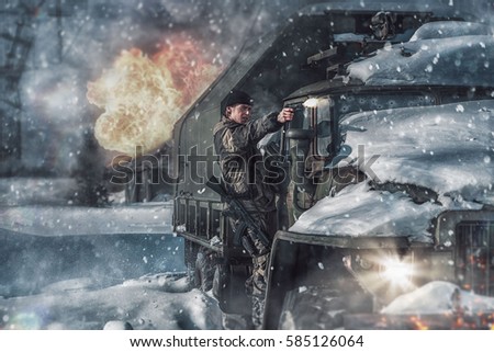 soldier with a gun and automatic machine in winter