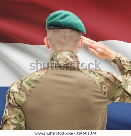 Soldier in hat facing national flag series - Netherlands