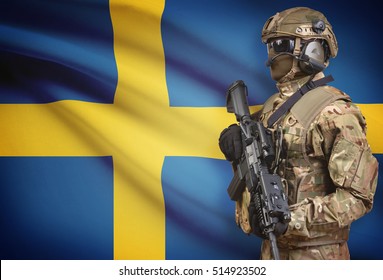 Soldier in helmet holding machine gun with national flag on background - Sweden