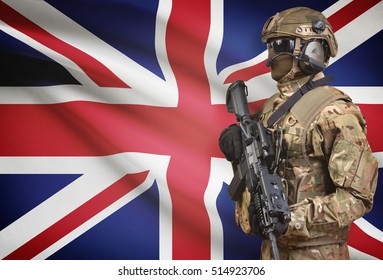 Soldier In Helmet Holding Machine Gun With National Flag On Background - United Kingdom