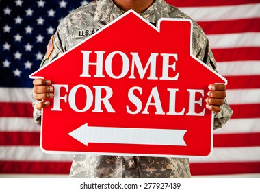 Soldier: Holding A Home For Sale Sign