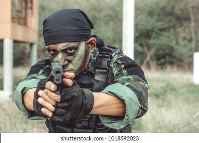 Soldier Holding Weapon. Chinese Male Soldier Aiming Pistol At Camera. Close Quarter Combat And Counter Terrorist Training Exercise. Special Force Army Ranger Team.