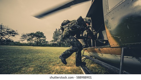 Soldier Looking Victorious With Apache Helicopter Fly Past