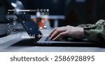 soldier man hand type on laptop to use program of radar and radio aviation for test system of tracking and defense at the dark control room center in monitor station for military technology concept