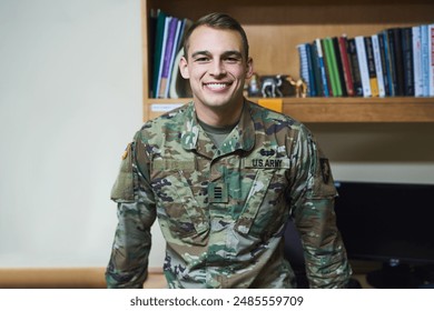 Soldier man, smile and portrait for service in bedroom at academy, military base and pride for USA. Person, army officer or happy with uniform, confidence or camouflage clothes for government in dorm - Powered by Shutterstock