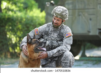 Soldier With Military Working Dog Outdoors