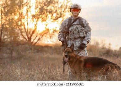 Soldier With Military Working Dog Outdoors
