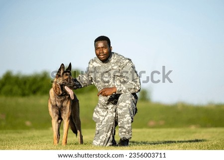 Soldier an military working dog training together.