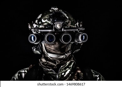 Soldier in night view goggles low key studio shoot