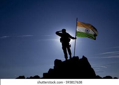 Soldier on top of the mountain with the Indian flag
