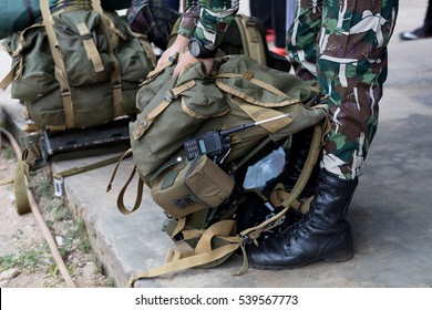 Soldier prepare knapsack before walk in the forest / Military backpack - Powered by Shutterstock