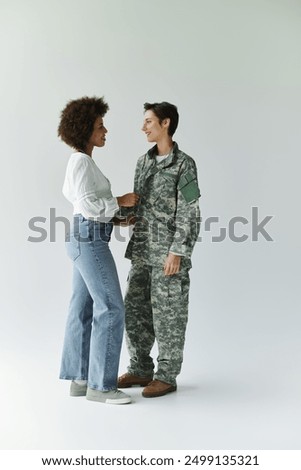 Similar – Image, Stock Photo Soldier standing on LGBTQ+ stairs