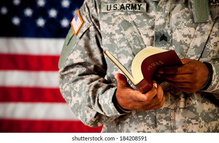 Soldier: Soldier Reading And Paging Through Bible