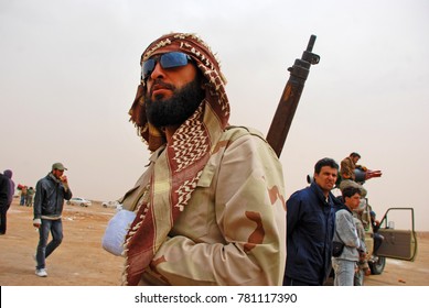 A Soldier From The Rebel Army Looks Away From The Battle Line. Ajdabiya, Libya, April 7, 2011.