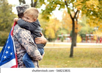 Soldier reunited with his family on a sunny day - Powered by Shutterstock