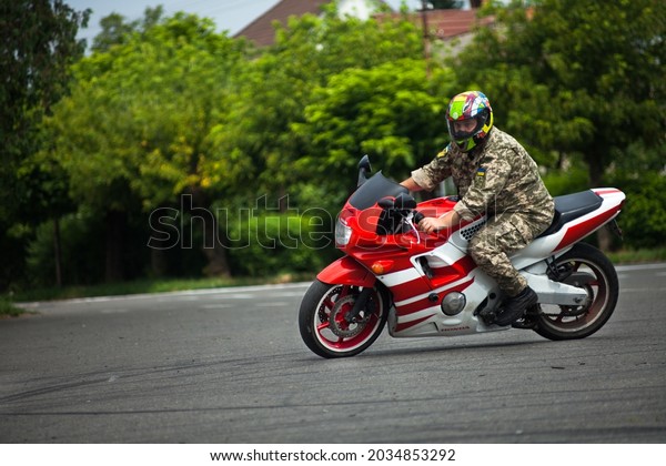 A soldier rides a motorcycle Honda CBR\
600 F2 (July 24, 2021, Uzhhorod,\
Ukraine)