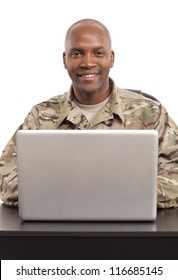 Soldier Smiles While Working On A Computer