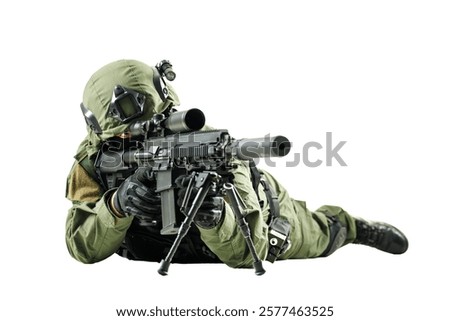 A soldier in a tactical uniform is lying down, aiming with a rifle. Captures military readiness, precision, and determination under challenging scenarios.